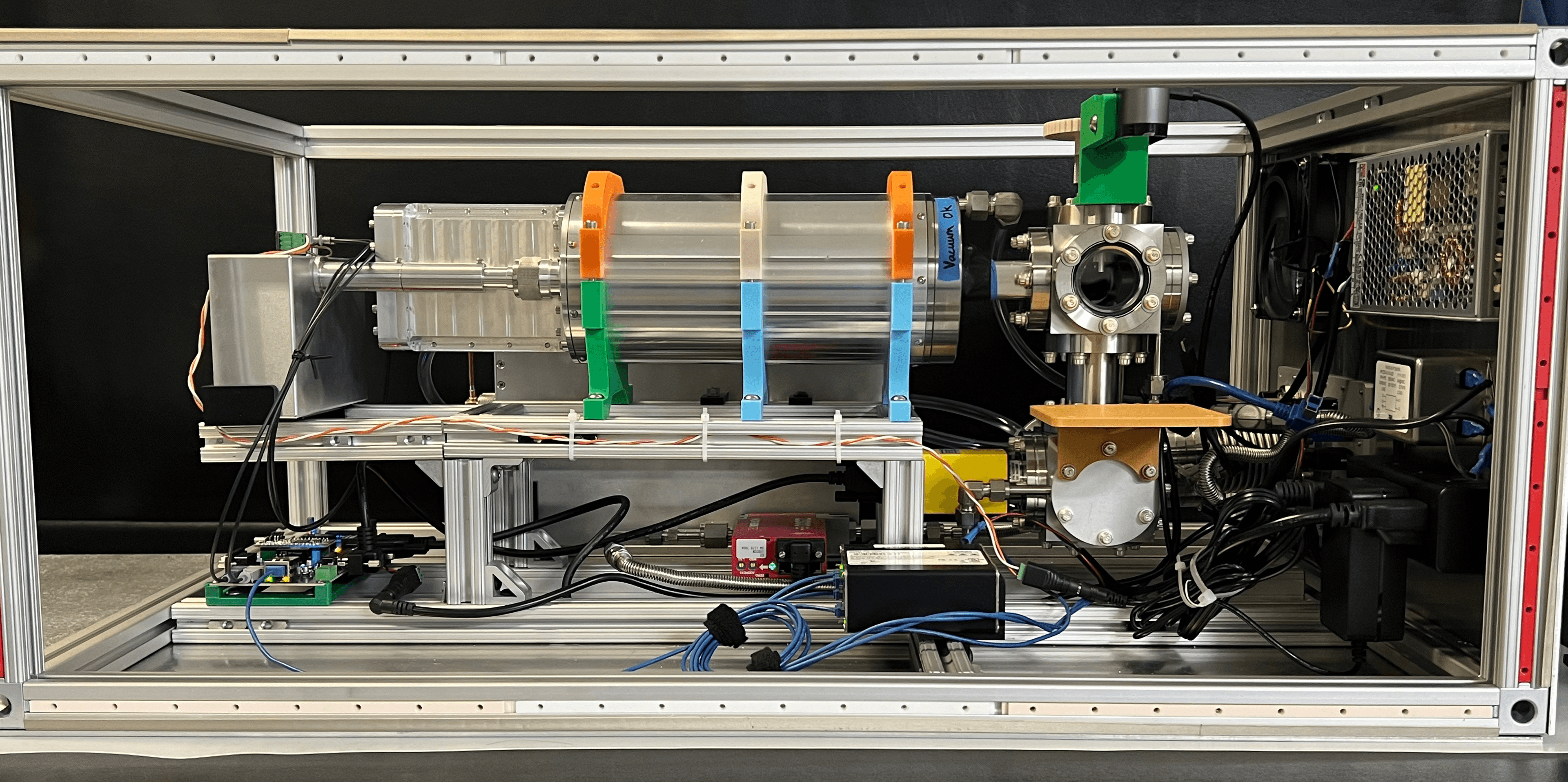The Alpha-E accelerator with its front panel open, showing the internal subsystems
